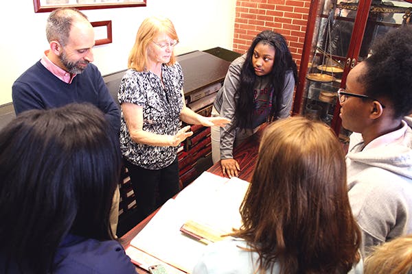 Students look at historic documents