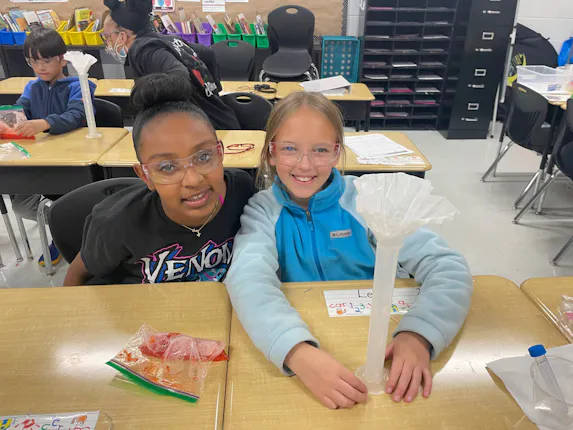 Students filtering strawberry DNA