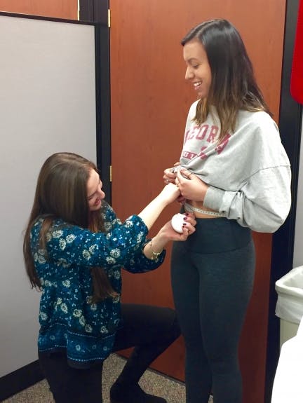 Waist circumference measurement following proper techniques. The tape measure is parallel to the floor and held snugly around the participant’s waist.