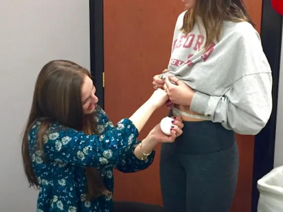 Waist circumference measurement following proper techniques. The tape measure is parallel to the floor and held snugly around the participant’s waist.