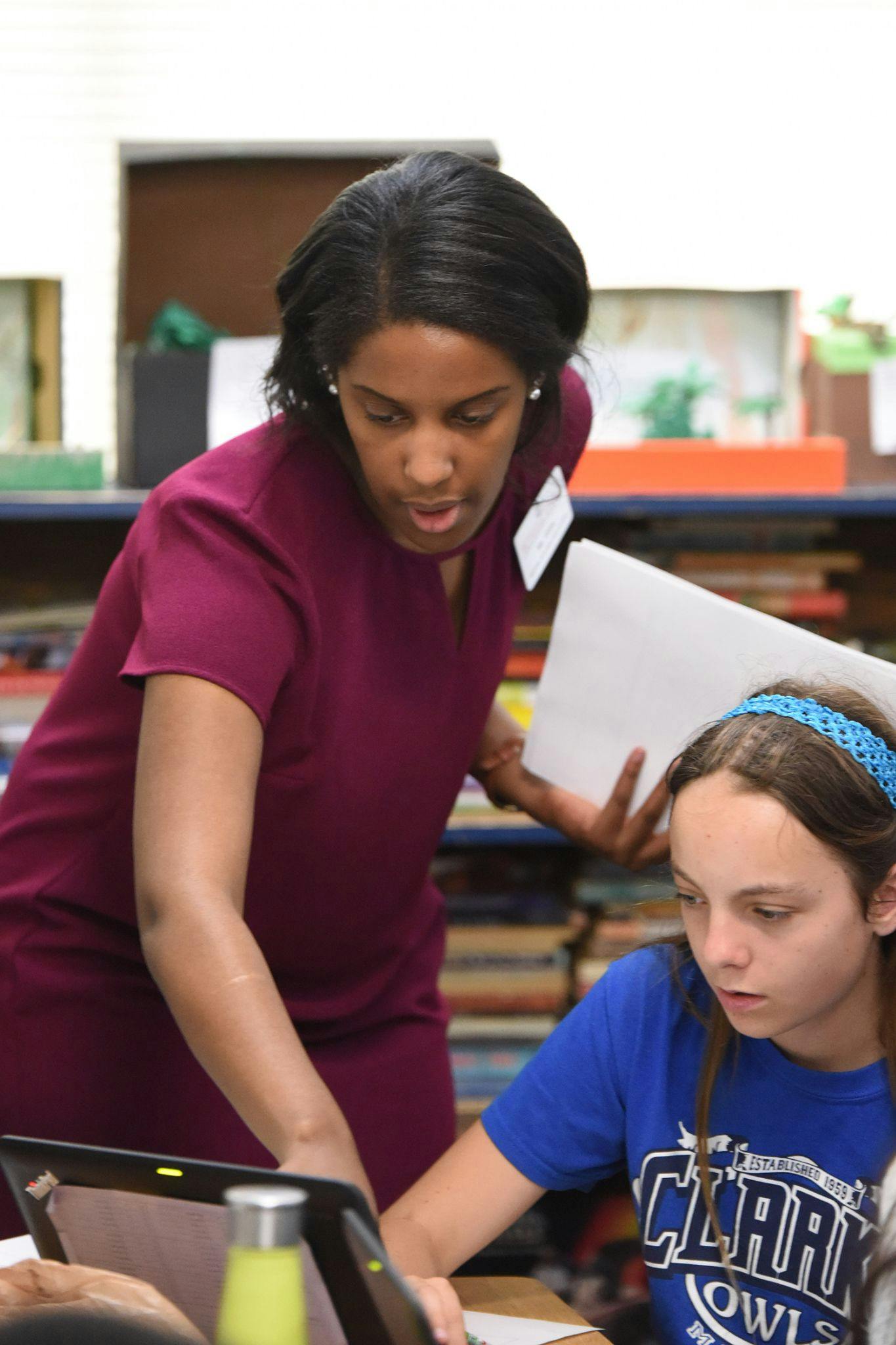 Teacher working with student